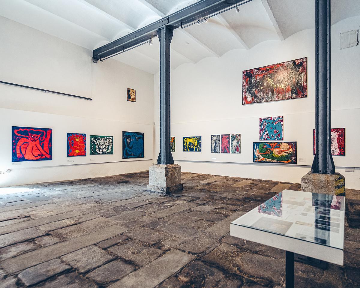 The interior of the Egon Schiele Art Centrum, with striking, expressive paintings on display.