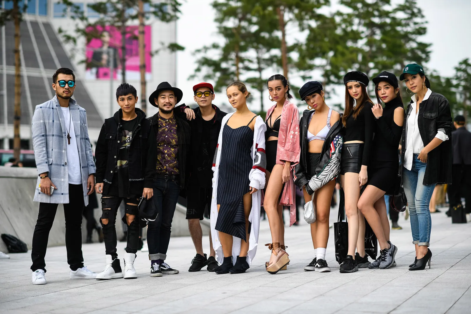 A group of stylish individuals wearing Acubi fashion-inspired outfits on the streets of Seoul.