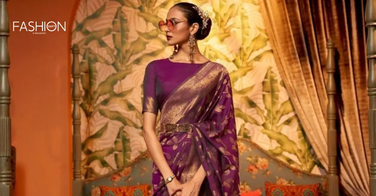 A fashion-forward model in a pre-draped saree with a statement belt, blending heritage with modernity.